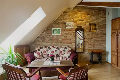 a living room with a couch and a table at Bernardinu B&B House in Vilnius