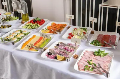a buffet table with many different types of food at City Hotels Algirdas in Vilnius