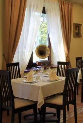 a table with a white table cloth on it at Grafo Zubovo Hotel & SPA in Bubiai