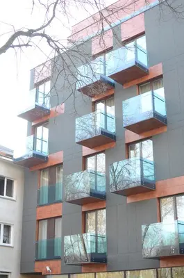 a building with balconies on the side of it at Viešbutis Simpatija in Druskininkai