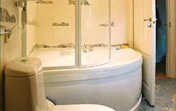 a bathroom with a toilet and a bath tub at Kaunas Apartments in Kaunas