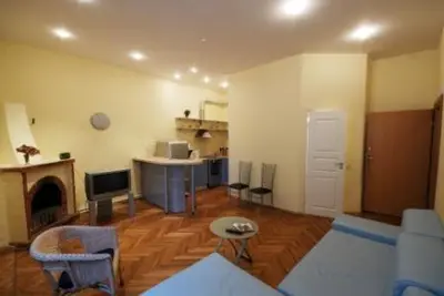 a living room with a couch and a table at Kaunas Apartments in Kaunas
