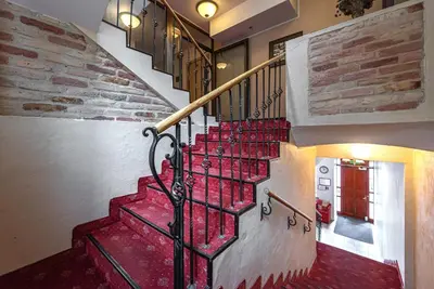 a staircase in a house with a red carpet at Alexa Old Town in Vilnius
