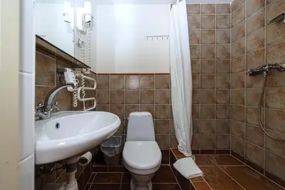 a bathroom with a toilet and a sink at Alexa Old Town in Vilnius