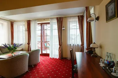 a living room with a couch and a table at Galia in Druskininkai