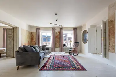 a living room with a couch and a table at Angel House Vilnius 29 in Vilnius
