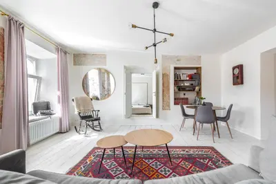 a living room with a table and chairs at Angel House Vilnius 29 in Vilnius