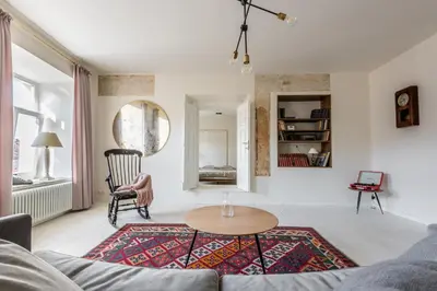 a living room with a couch and a table at Angel House Vilnius 29 in Vilnius