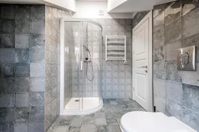 a bathroom with a shower and a tub and a toilet at Angel House Vilnius 40 in Vilnius