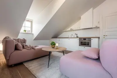 a living room with a couch and a table at Angel House Vilnius 40 in Vilnius