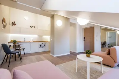 a living room with a couch and a table at Angel House Vilnius 38 in Vilnius