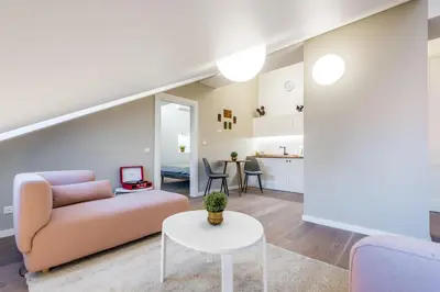 a living room with a couch and a table at Angel House Vilnius 38 in Vilnius
