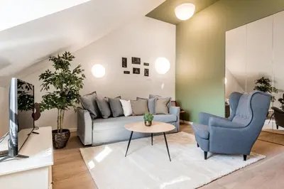 a living room with a couch and a table at Angel House Vilnius 38A in Vilnius