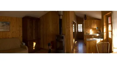 a kitchen with a stove in the middle of a room at Love Island Guesthouse in Druskininkai