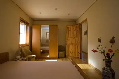 a room with a bed and a bathroom at Love Island Guesthouse in Druskininkai