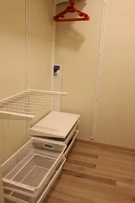 a empty refrigerator with a shelf and a hanger at Near Park Apartment in Druskininkai