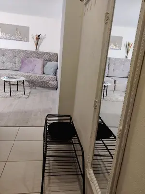 a room with a bunk bed and a couch at Apartment Dalyce in Šiauliai