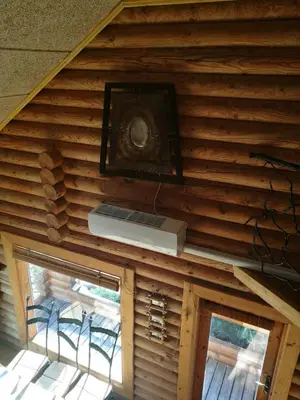 a ceiling of a log cabin with a window at Sveciu namelis in Šiauliai