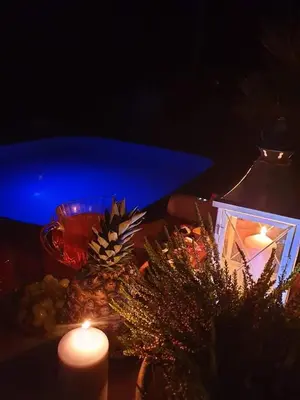 a table with candles and christmas decorations on it at Sveciu namelis in Šiauliai