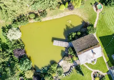 an aerial view of a large puddle of water at Sveciu namelis in Šiauliai