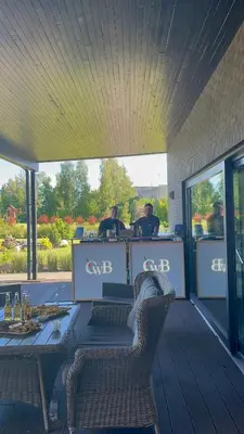 a restaurant with two people sitting at a table at Villa Orchidea in Šakiai