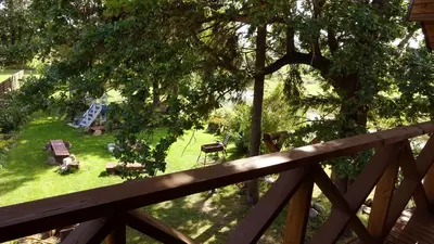 a view of a yard from a wooden fence at Raudonkalnis in Mankiškiai