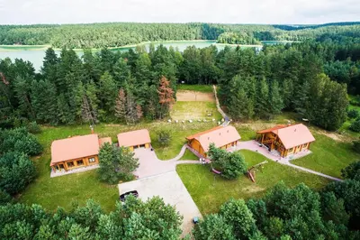 an aerial view of an estate with a house at Asvejos slenis in Sužionys