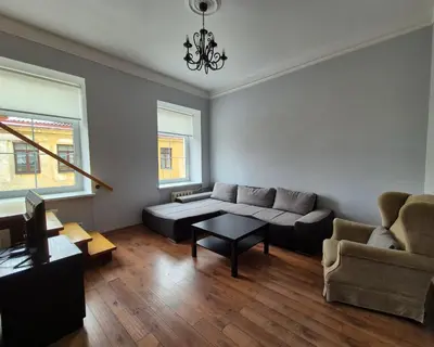a living room with a couch and a table at Apartments in old town Latako Street in Vilnius