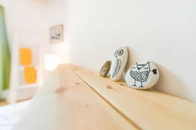 a wooden table with three vases on top of it at Downtown Forest Hostel & Camping in Vilnius