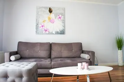 a living room with a couch and a table at Mono Ray Apartments in Druskininkai