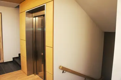 a elevator in a room with a wall at Mono Ray Apartments in Druskininkai