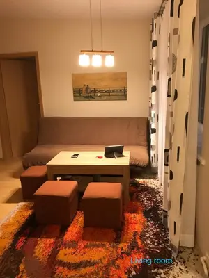 a living room with a couch and a coffee table at Roman in Druskininkai