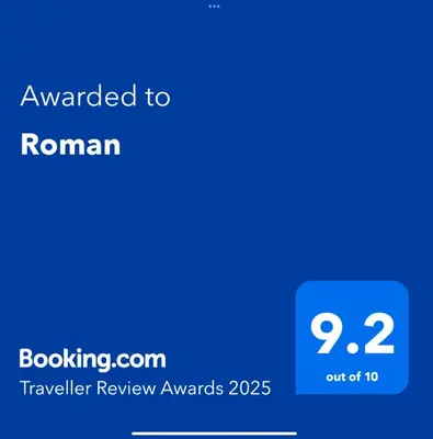 a screenshot of a phone with the text translated to roman at Roman in Druskininkai