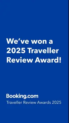 a blue sign that says weve won a traveler review award at Roman in Druskininkai