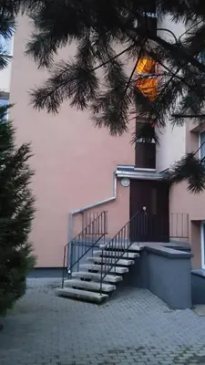 a building with stairs in front of a building at Čiurlionio 83 Druskininkai in Druskininkai