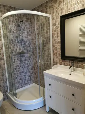 a bathroom with a shower and a sink at Dru-Sky in Druskininkai
