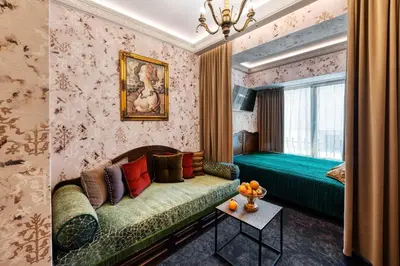 a living room with a couch and a window at Sofijos Rezidencija in Birštonas