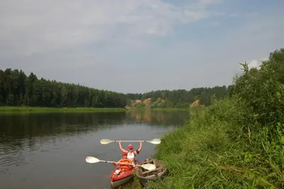 a person in a kayak on a river at Sofijos Rezidencija in Birštonas