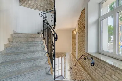 a staircase in a house with a window at HaPPy InnSide, Free Parking, Self check-in 7x24h, AC in Vilnius