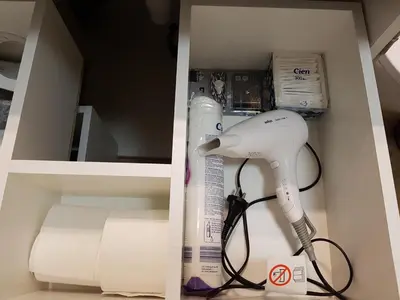 a box with a hair dryer and a wii controller at HaPPy InnSide, Free Parking, Self check-in 7x24h, AC in Vilnius