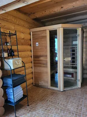 a room with sliding glass doors in a wooden wall at Graikinė in Kėdainiai