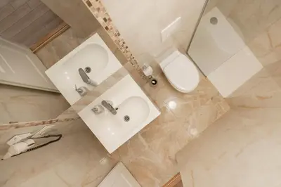 an overhead view of a bathroom with a sink and a toilet at Guoda Apartments in Vilnius