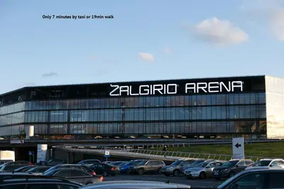 a large building with a sign on the side of it at Petro delux apartments in Kaunas