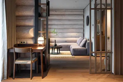 a living room with a couch and a table at Esperanza Lake Resort, a Member of Design Hotels in Trakai