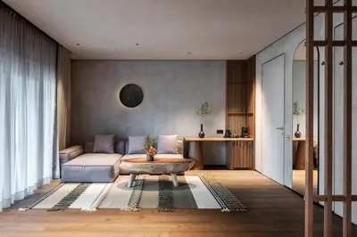 a living room with a couch and a coffee table at Esperanza Lake Resort, a Member of Design Hotels in Trakai