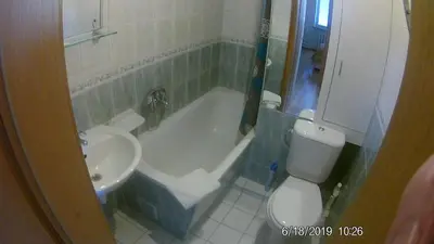 a bathroom with a tub and a toilet and a sink at Family in Kaunas