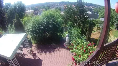 a view of a garden with flowers on a balcony at Family in Kaunas