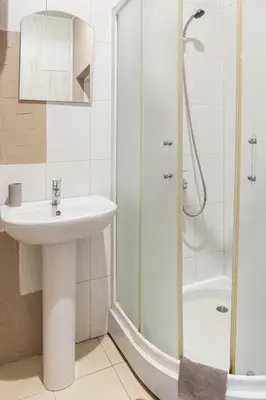 a bathroom with a sink and a shower at Pigi nakvyne in Šiauliai