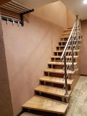 a staircase in a building with wooden steps at Zveryno guest house in Vilnius