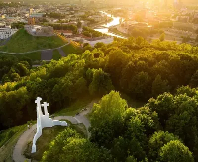 a view of a park with a white statue on a hill at Cozy appartment in the Heart of Old Town with free parking in Vilnius